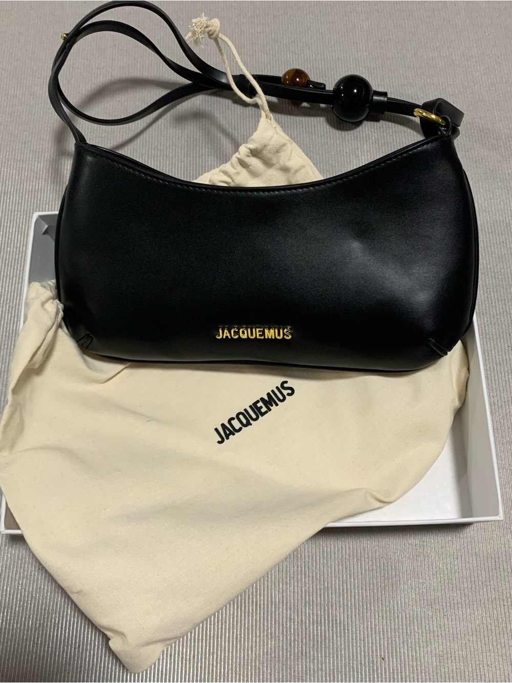 Jacquemus Black Leather Shoulder Bag with Gold Logo Bead Strap